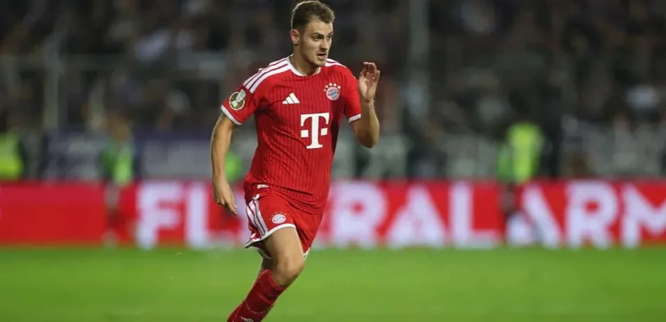 Player in red Bayern Munich kit running on field