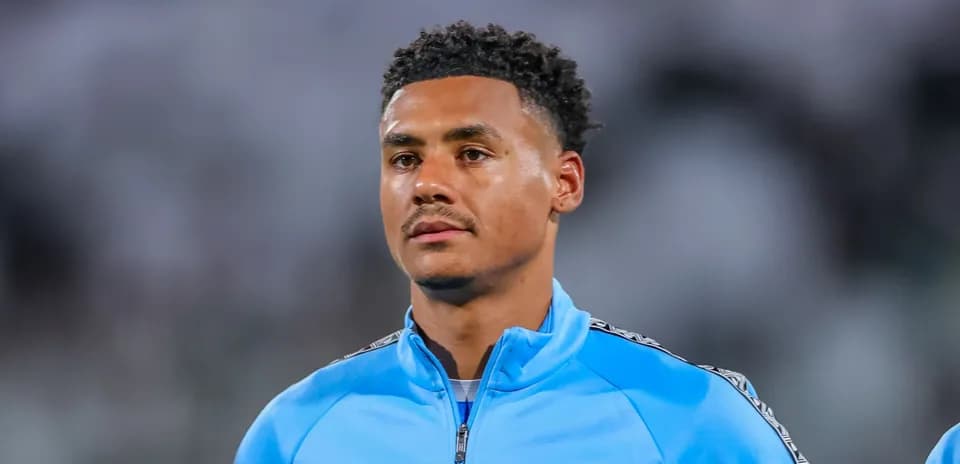 Player in blue training kit before match