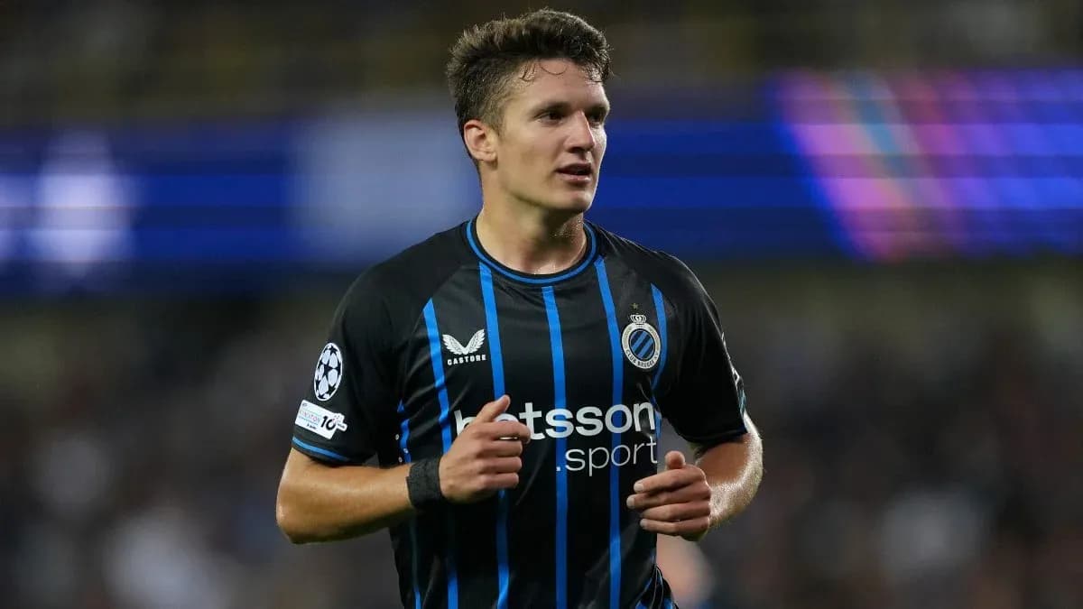 Player in black and blue jersey during match