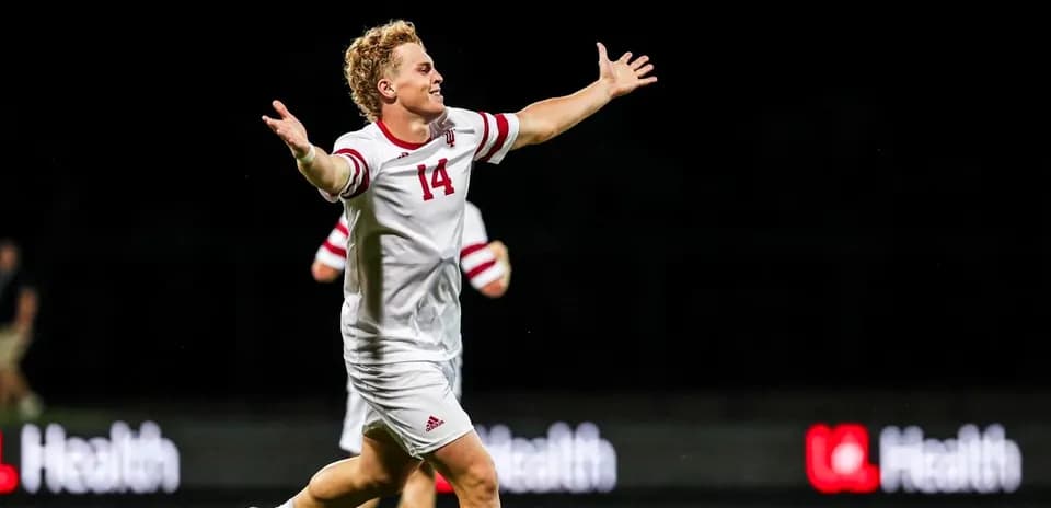 Player celebrating a goal on the field