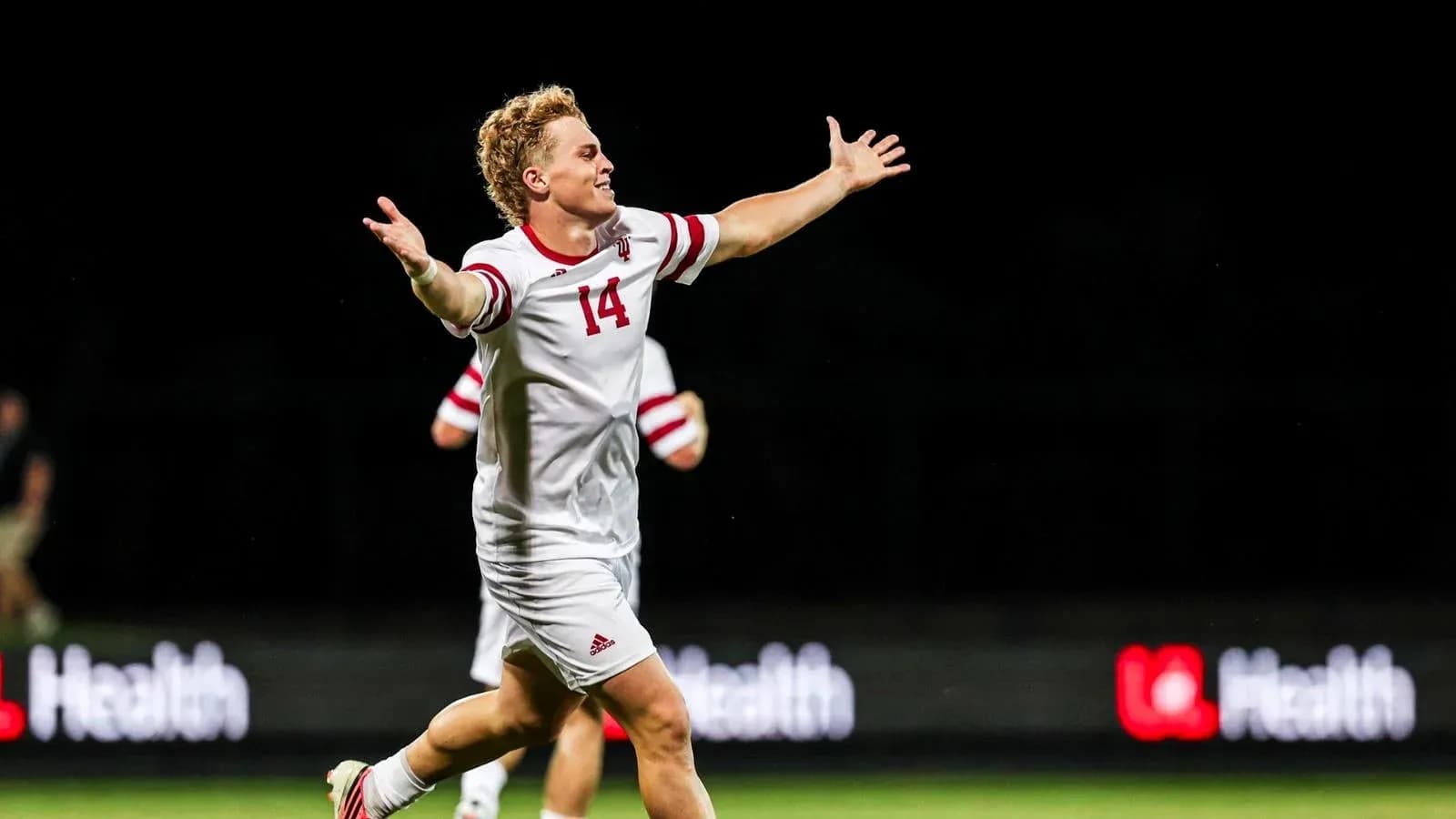 Player celebrating a goal on the field