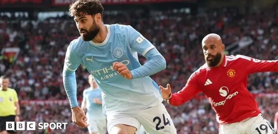 Manchester City player running with the ball