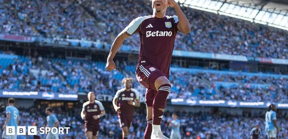 Aston Villa player celebrating in front of fans