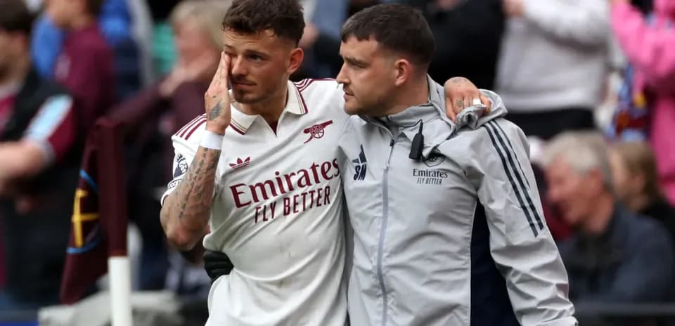 Player receiving support from staff after match