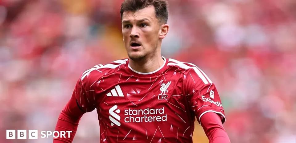 Liverpool player in red kit during match action