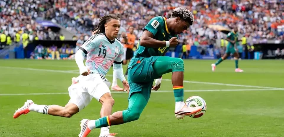 Player dribbling the ball while being chased