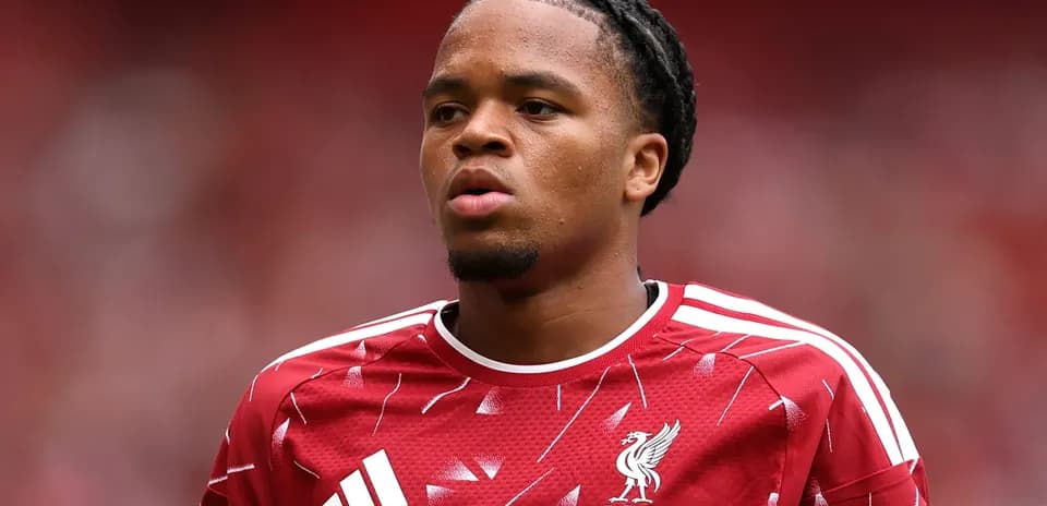 Player in Liverpool kit during match warm-up