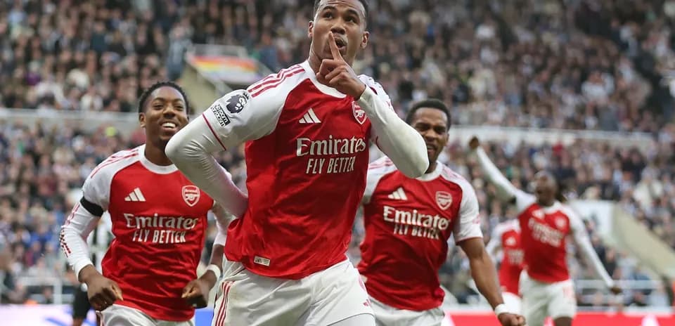 Arsenal players celebrating a goal in the match