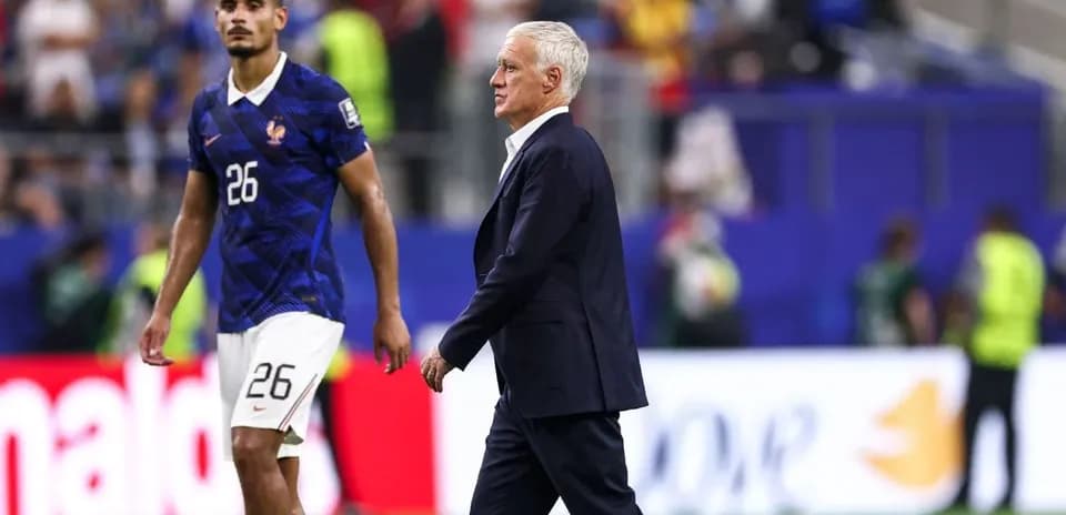 France coach walking past player after match