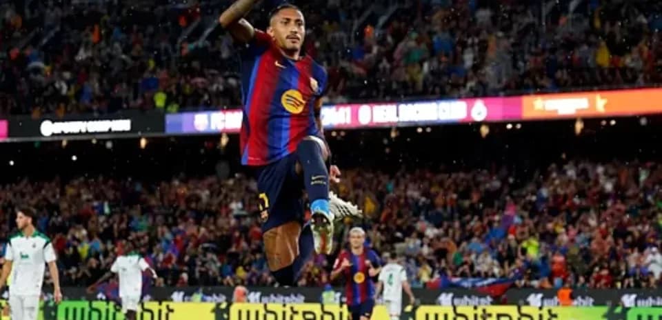 Player celebrating after scoring a goal during match