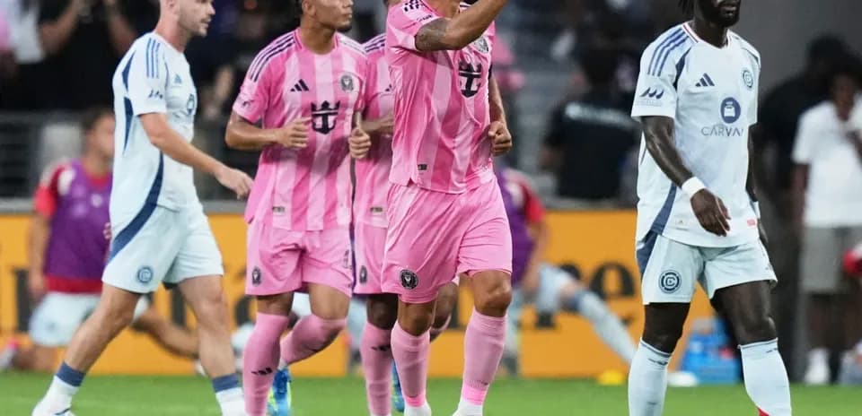 Players celebrating a goal during a match
