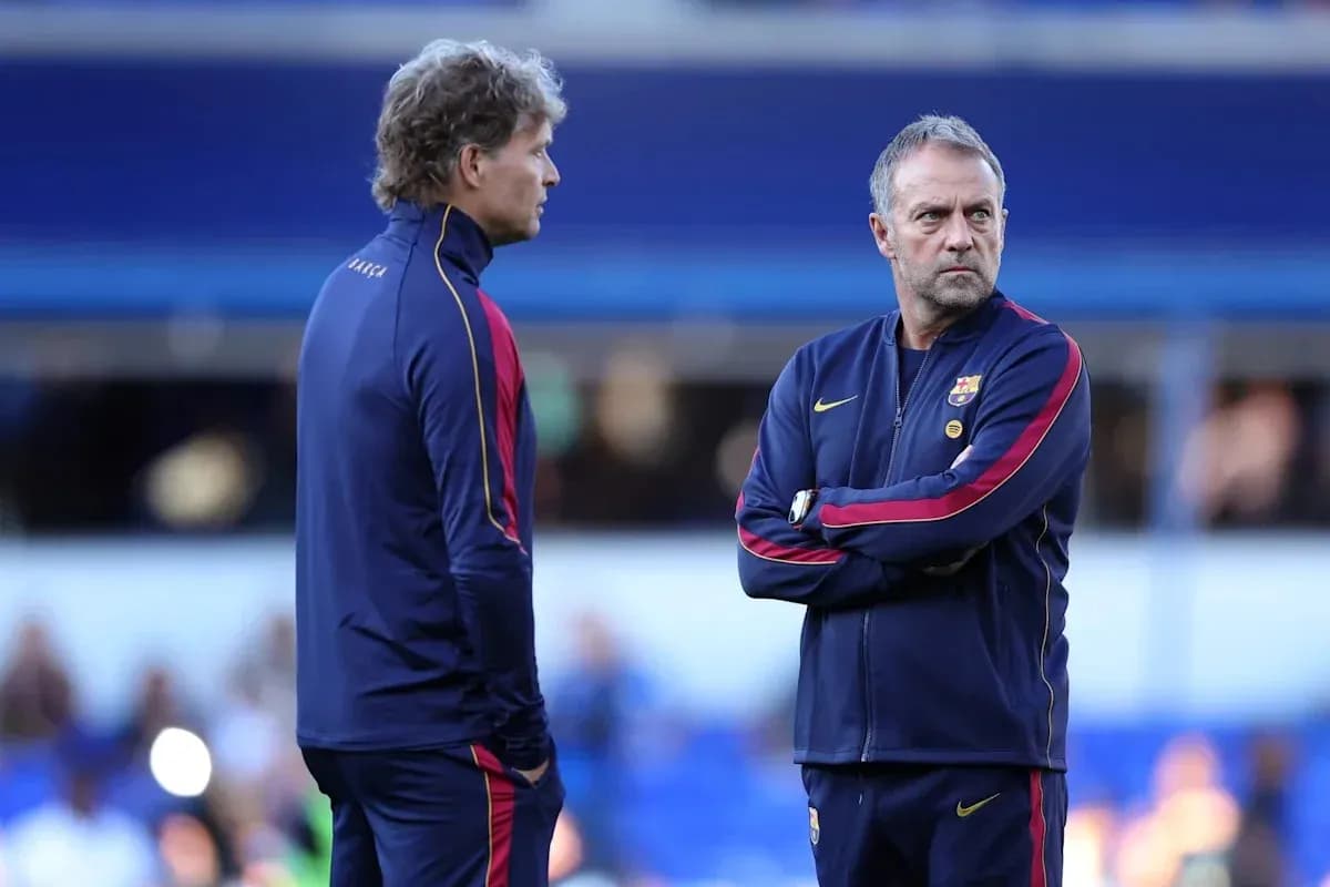 Two coaches discussing strategy on the sidelines