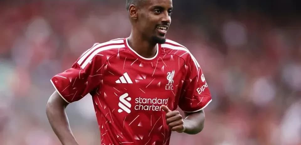 Player celebrating in Liverpool FC red jersey