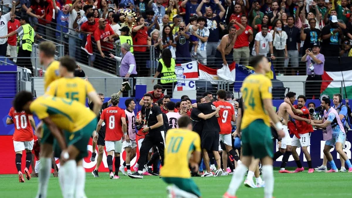 Players celebrating with fans after match victory
