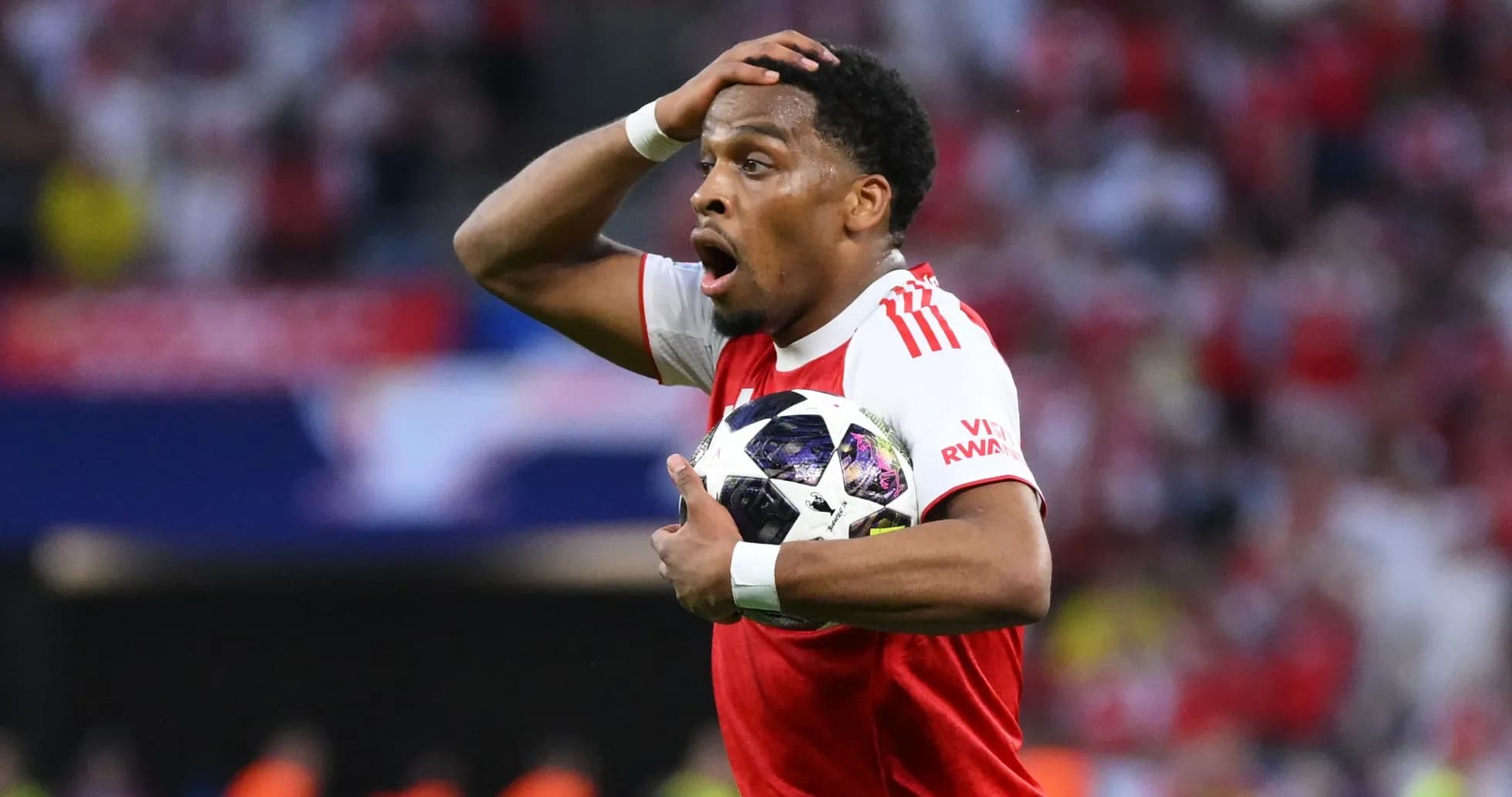 Player holding ball with shocked expression during match