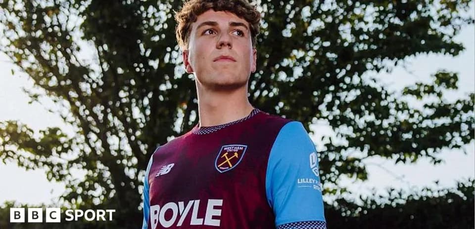 Player wearing West Ham United jersey outdoors