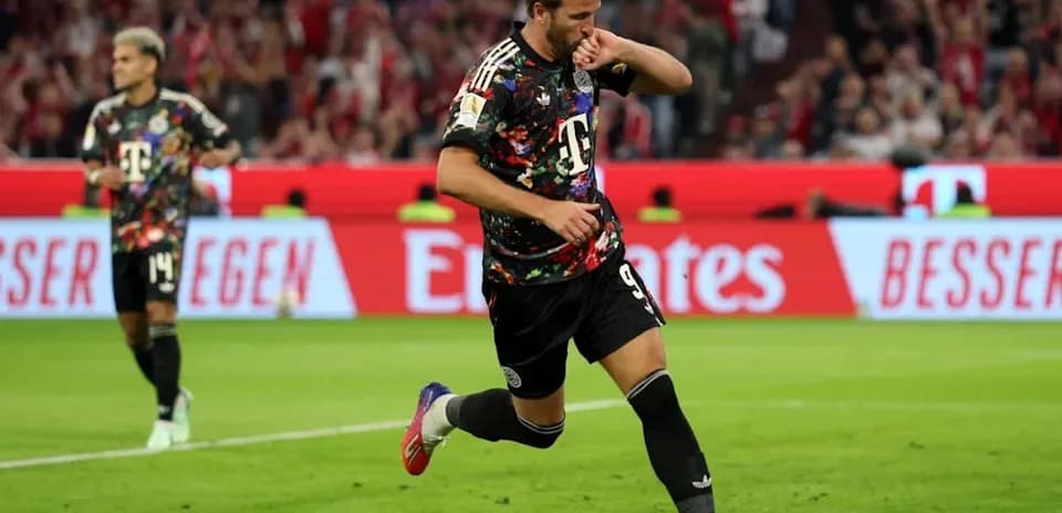 Player celebrating a goal in colorful jersey