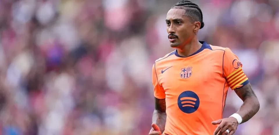 Player in orange Barcelona kit during match