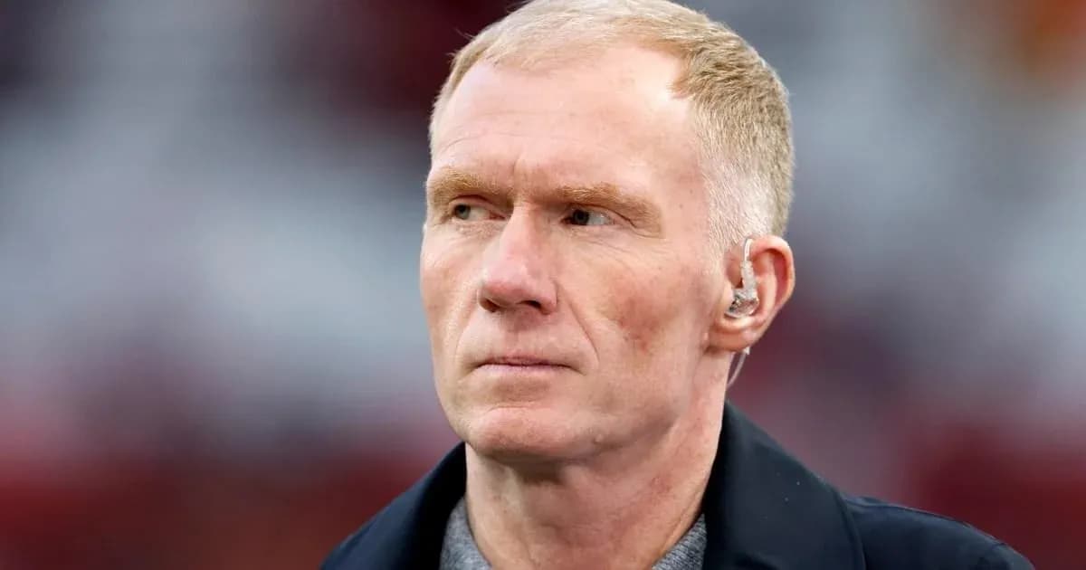 Person with short hair wearing an earpiece