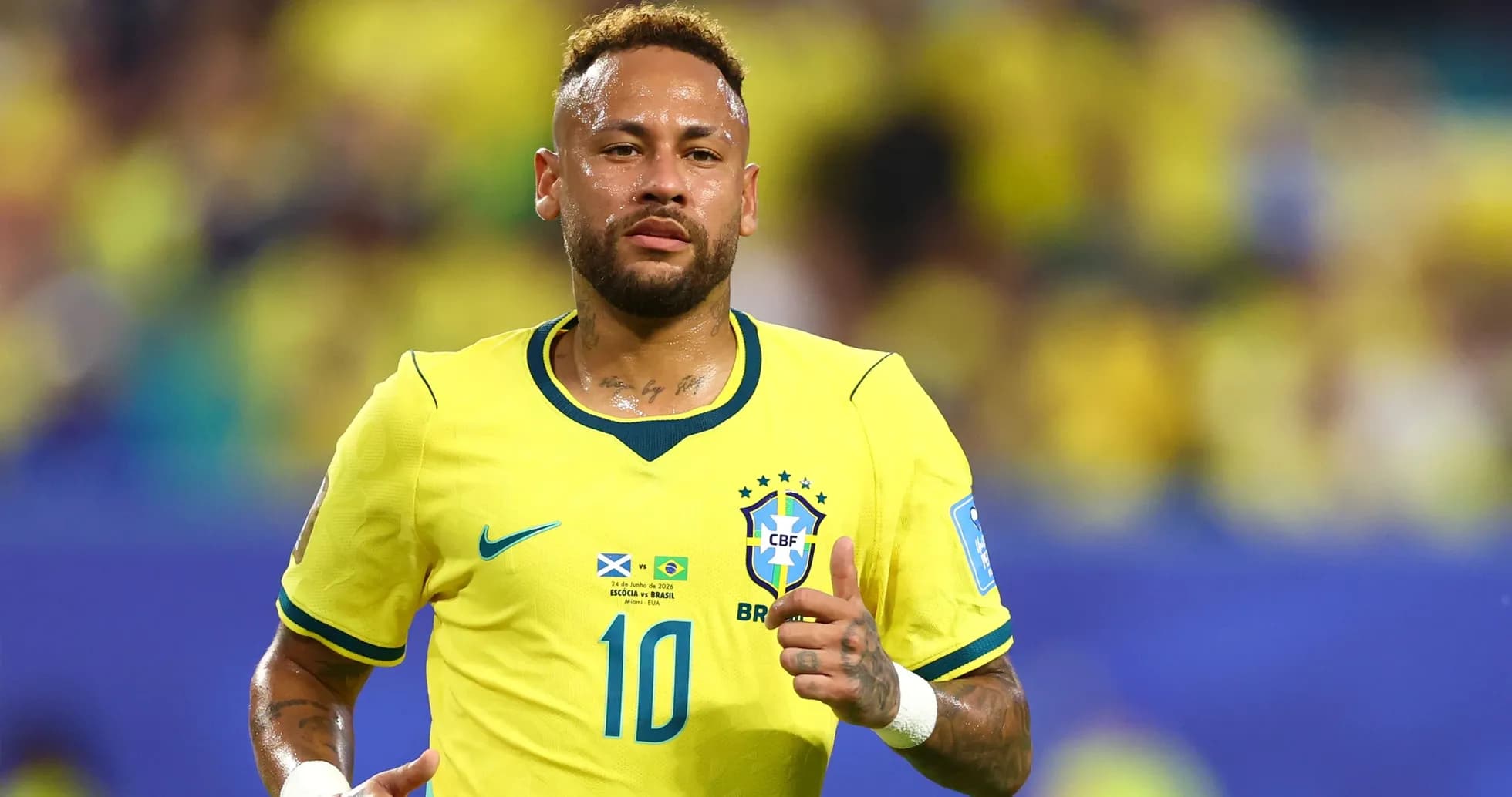 Neymar running on the pitch in Brazil jersey