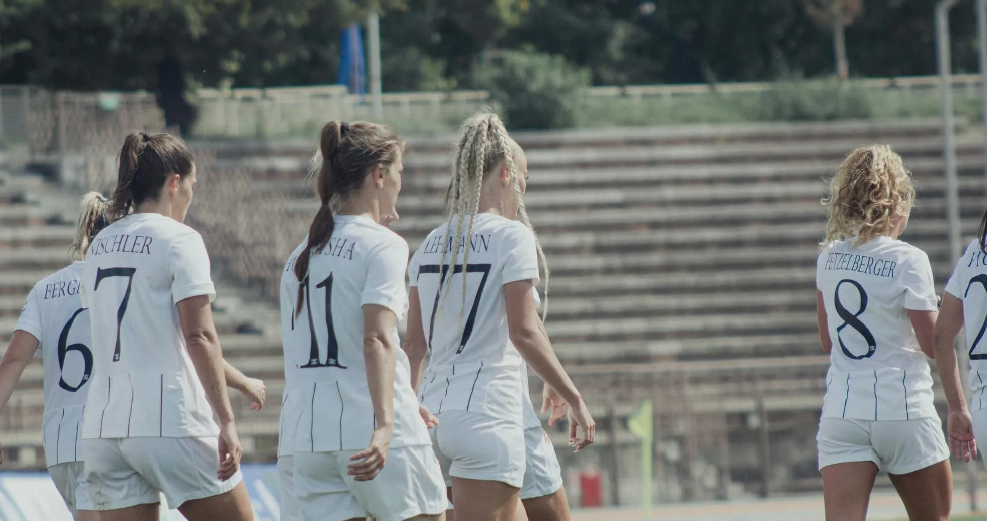 Women players walking on the football pitch