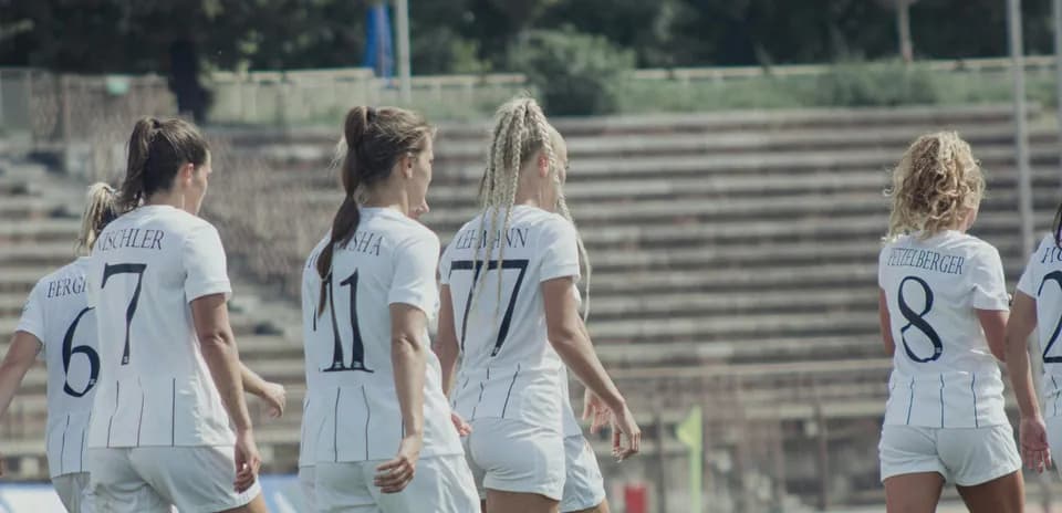 Women players walking on the football pitch