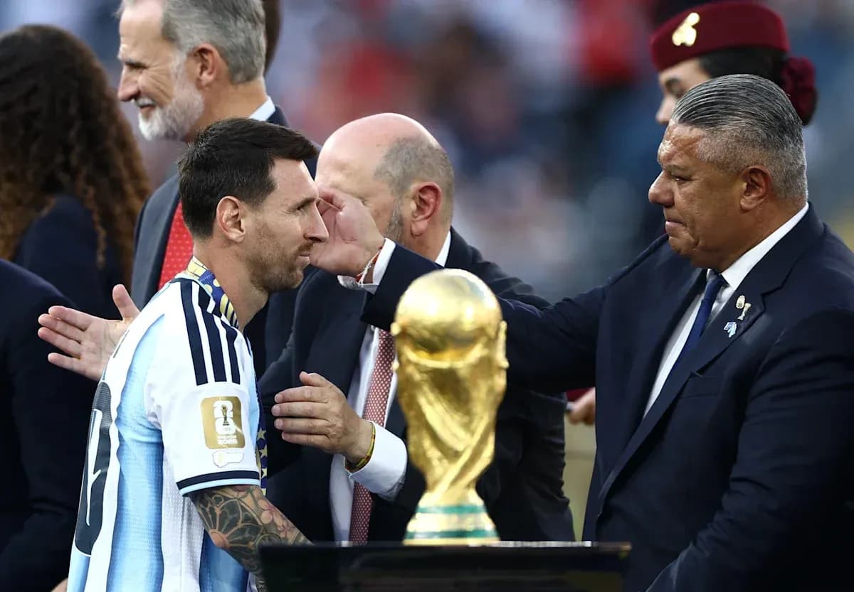 Lionel Messi receiving trophy during awards ceremony