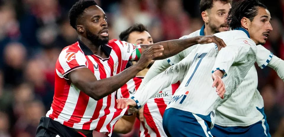 Athletic Club players competing for the ball