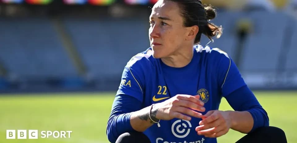 Player in Chelsea kit sitting on the field