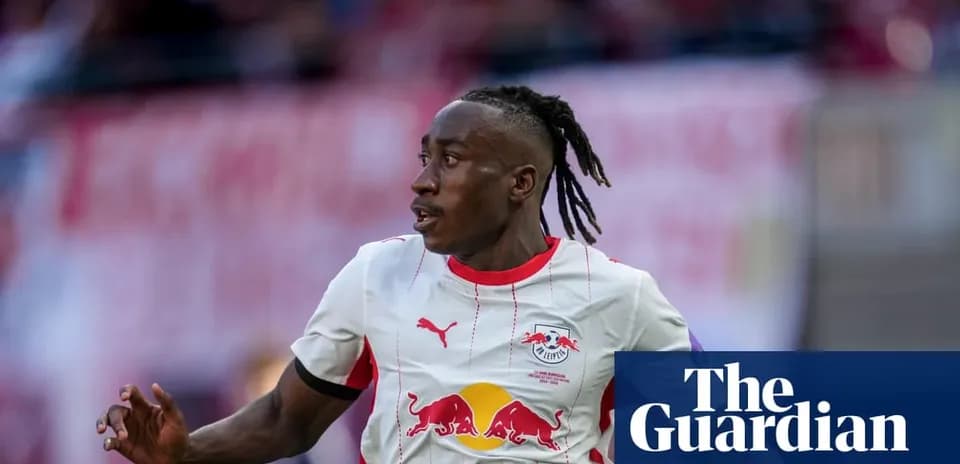 Player in RB Leipzig kit running on the field