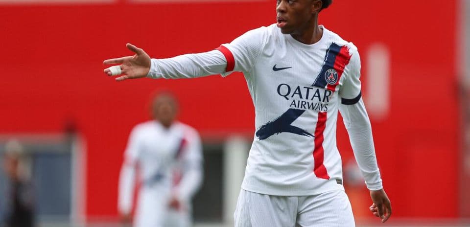 Player gesturing during a match in PSG kit