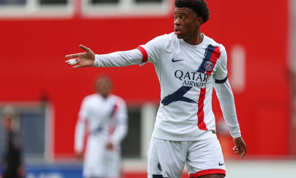 Player gesturing during a match in PSG kit