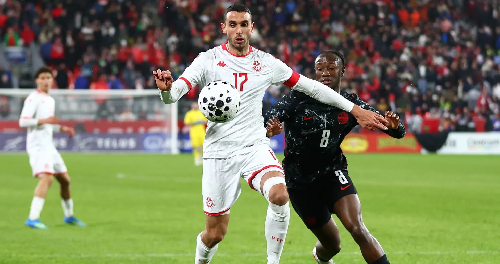 Tunisian player controlling the ball during match