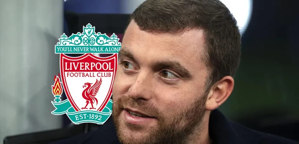 Close-up of a man with Liverpool FC logo