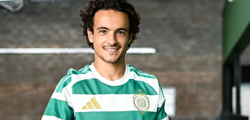 Player in green and white striped jersey posing