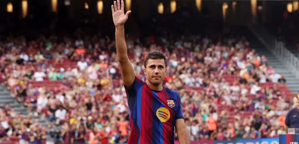 Player waving to crowd at stadium event