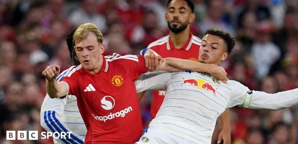Two players challenging for the ball during match
