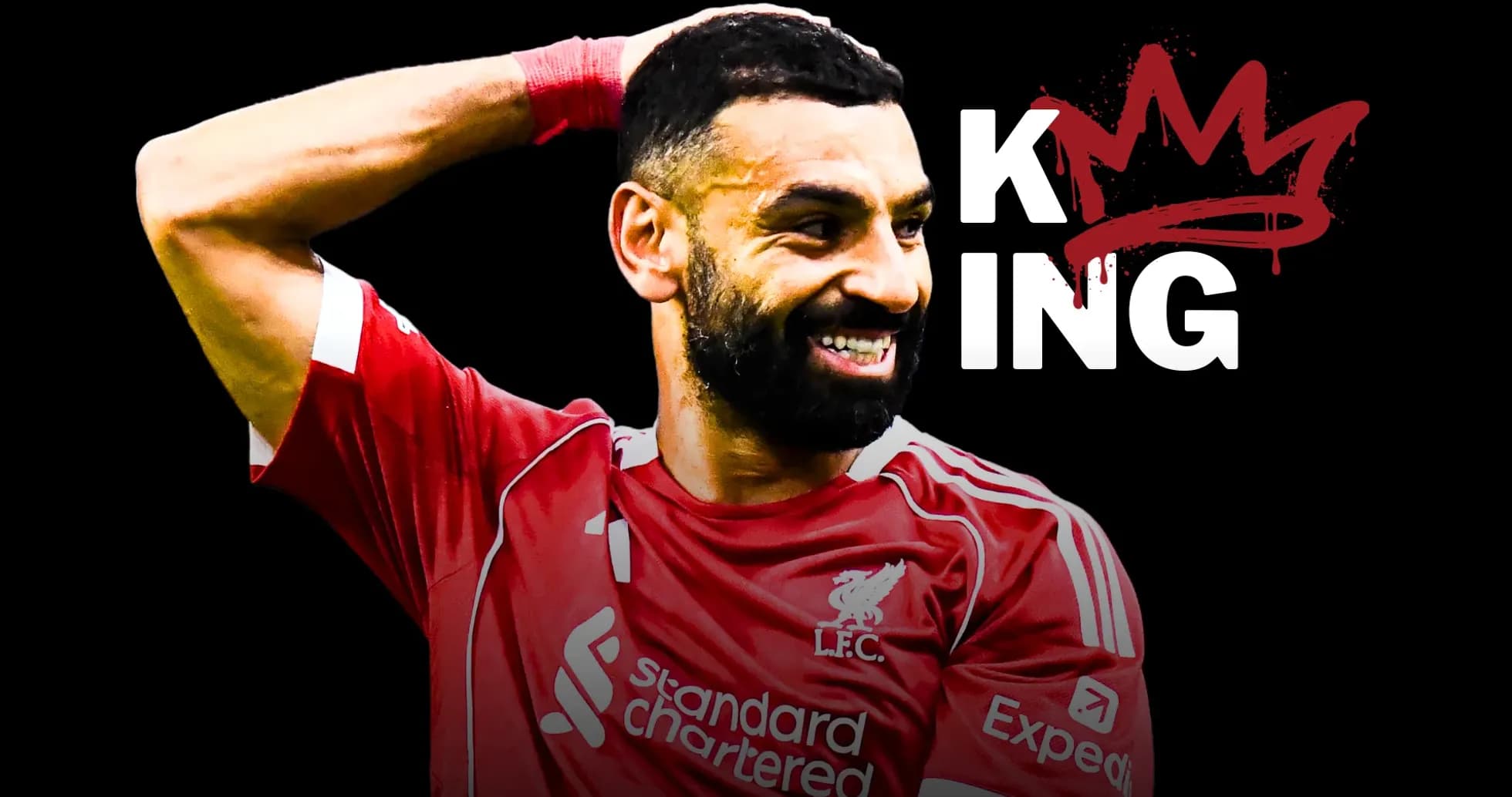 Player celebrating in Liverpool kit with crown graphic
