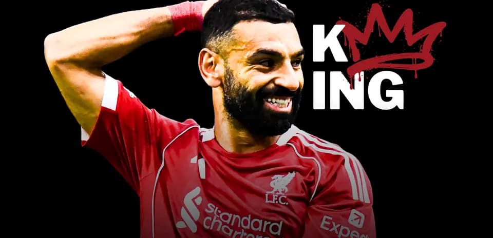 Player celebrating in Liverpool kit with crown graphic