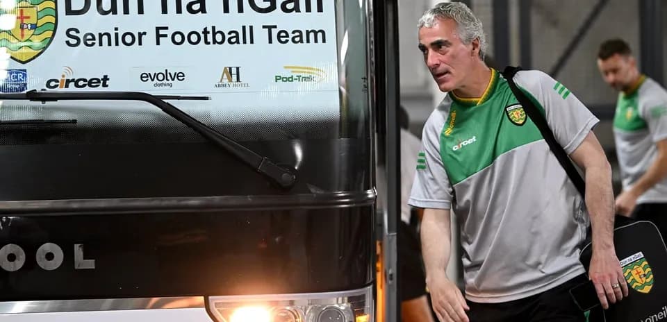 Manager exiting team bus before match