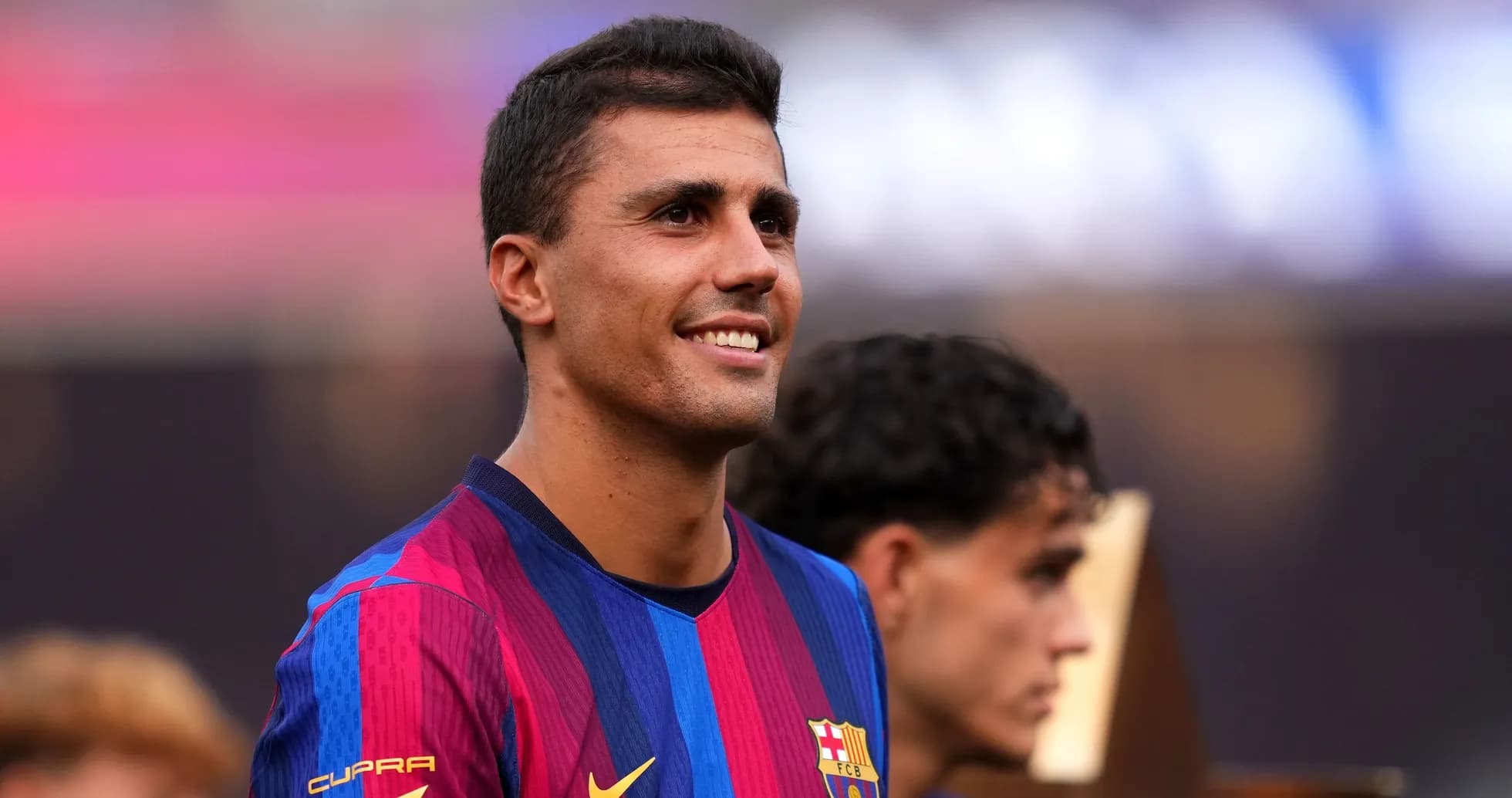 Barcelona player smiling during trophy presentation ceremony