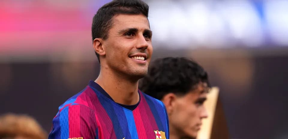 Barcelona player smiling during trophy presentation ceremony