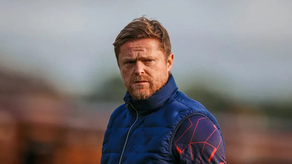 Coach observing training session on the field