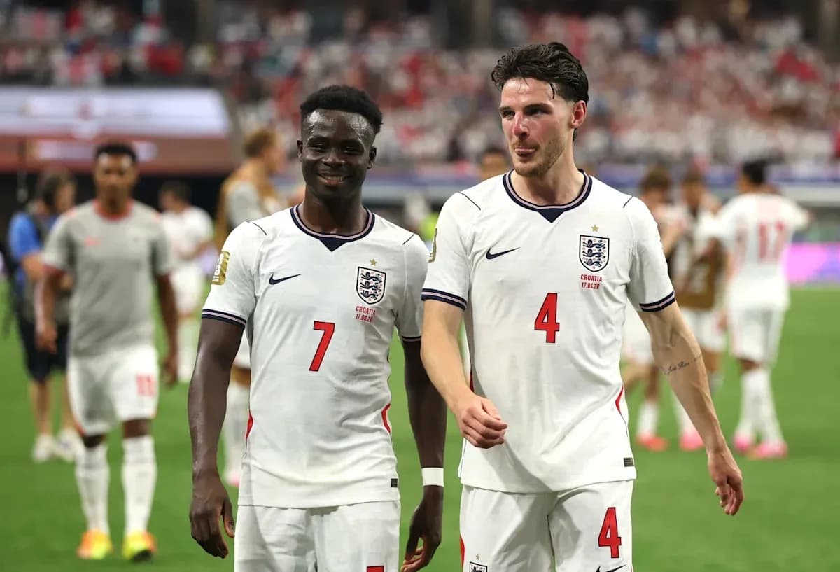 Two England players walking off the pitch together
