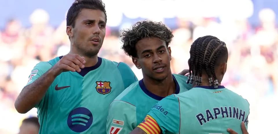 Barcelona players celebrating a goal on the field