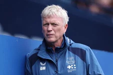 Manager observing from the sideline during match