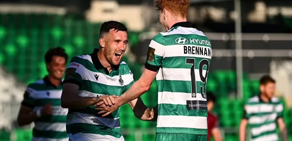 Players celebrating a goal on the pitch