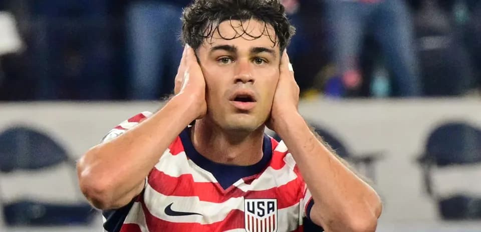 Player reacting during a soccer match wearing USA jersey