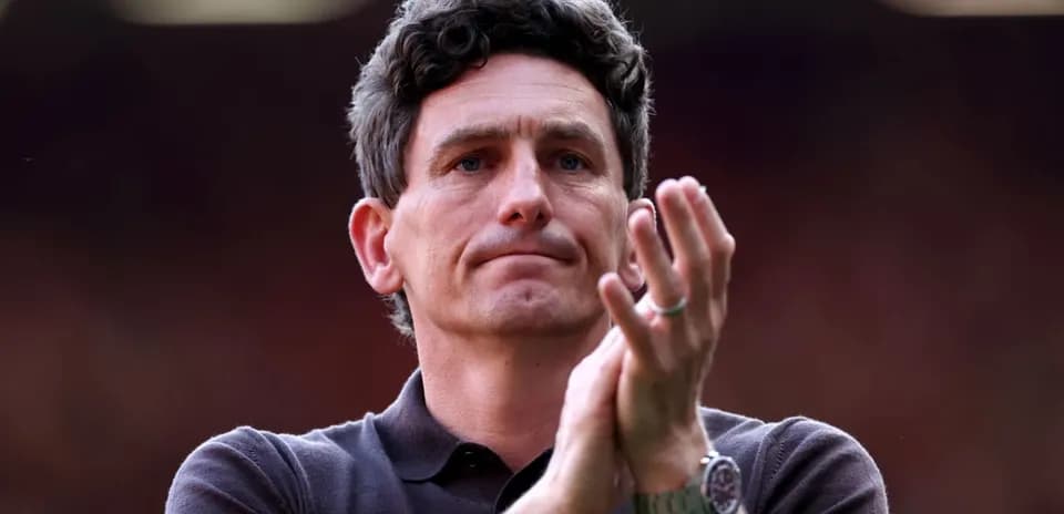 Man clapping during a football match