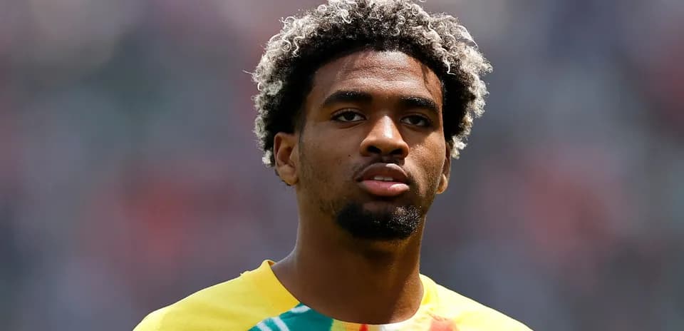 Player in colorful jersey during match warm-up